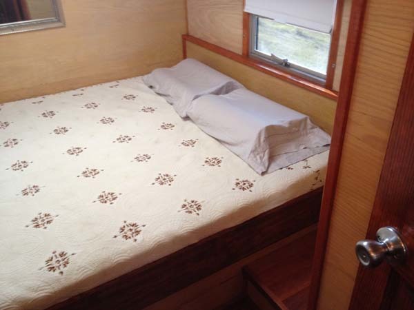 The master bedroom is at the rear of the bus.