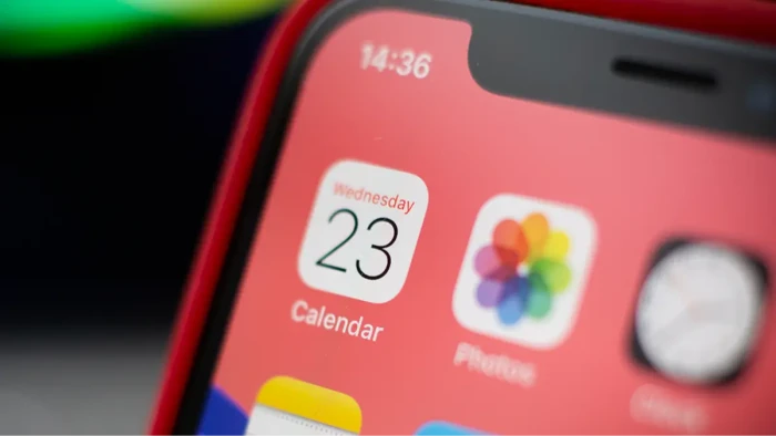 iOS calendar interface with spam event entries linked to phishing URLs