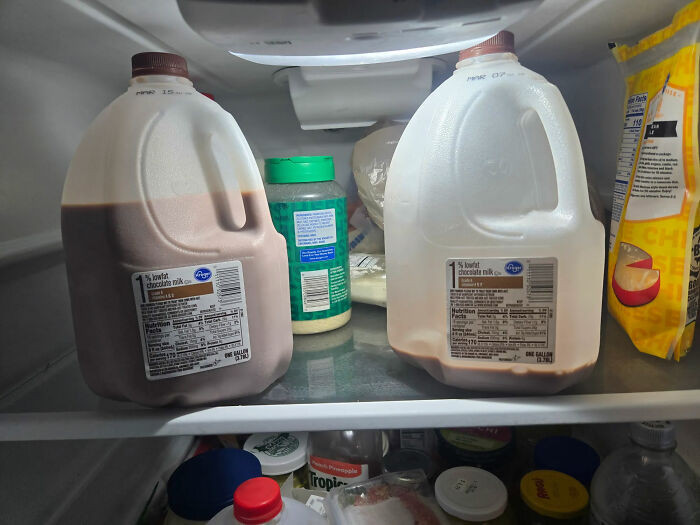 The Tale Of Two Choccy Milk Jugs. Both Were In Date; The Nearly Empty One Was In Front Of The Other One (That Was Unopened)