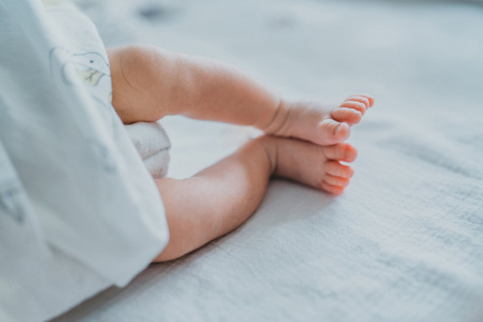 Social media reaction graphic shows comments debating the nickname “Sugar” for a baby girl.