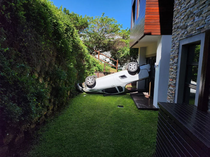 "Less Than 10 Minutes Ago, A Delivery Guy Forgot To Use His Handbrake On Our Steep Driveway. His Car Rolled Over The Ledge And Garden And Then Fell In Front Of Our Living Room 3-4 Meters Down"