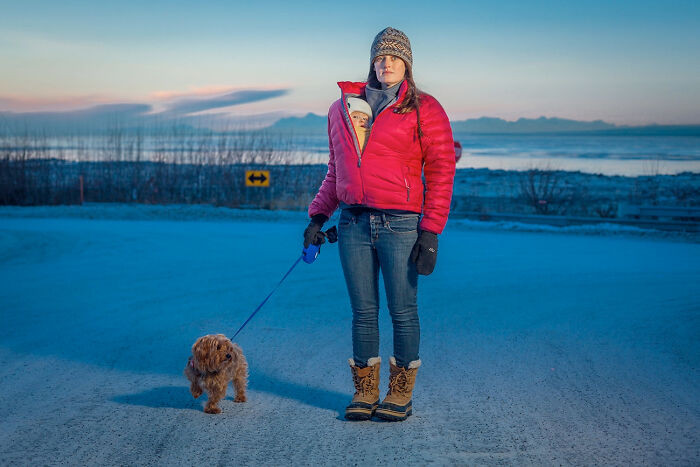 Kaitlyn Reiley Walks With Her Seven-Month-Old Daughter, Beatrice, And Her Dog, Jack, Near Her Home On A Cold January Day In Anchorage, Alaska, 2015 From The Series 'Portrait-A-Day' By Clark James Mishler