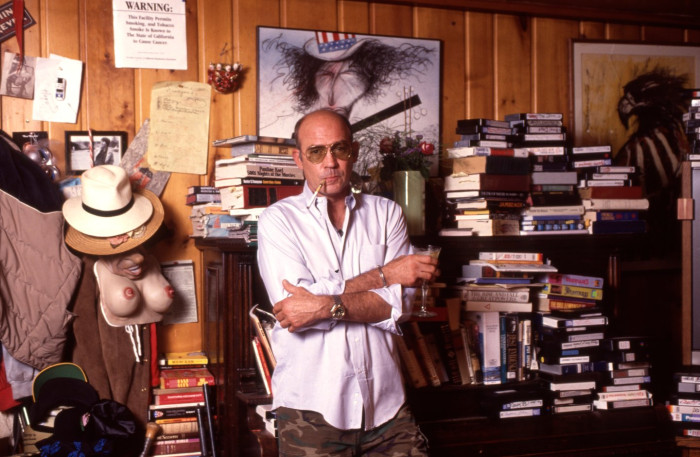 Hunter S. Thompson in a dramatic pose, gonzo journalism legacy context.