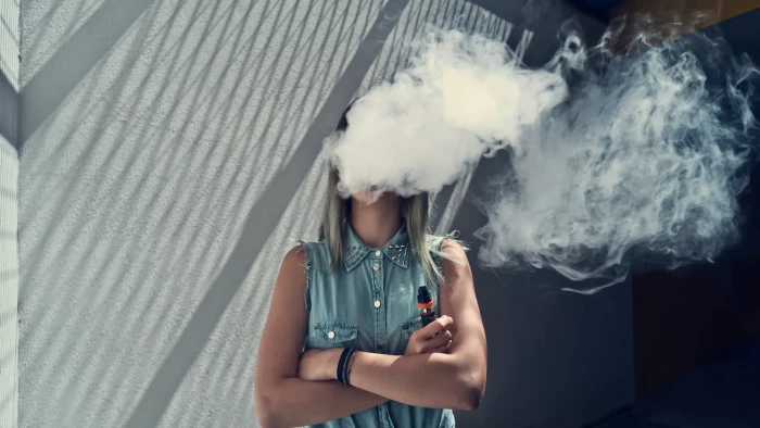 Split graphic illustrating vaping risks, lung damage, and cardiovascular effects over time