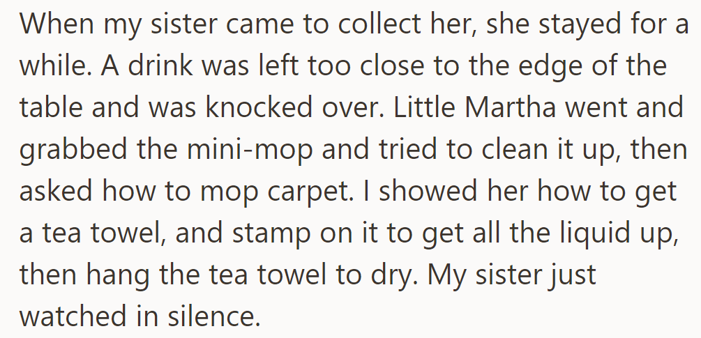 When OP's sister arrived, Martha spilled a drink. She used a mini-mop and asked how to mop the carpet. OP showed her with a tea towel as their sister watched.