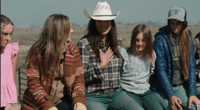 Mother with four daughters named Mary, smiling in a family portrait