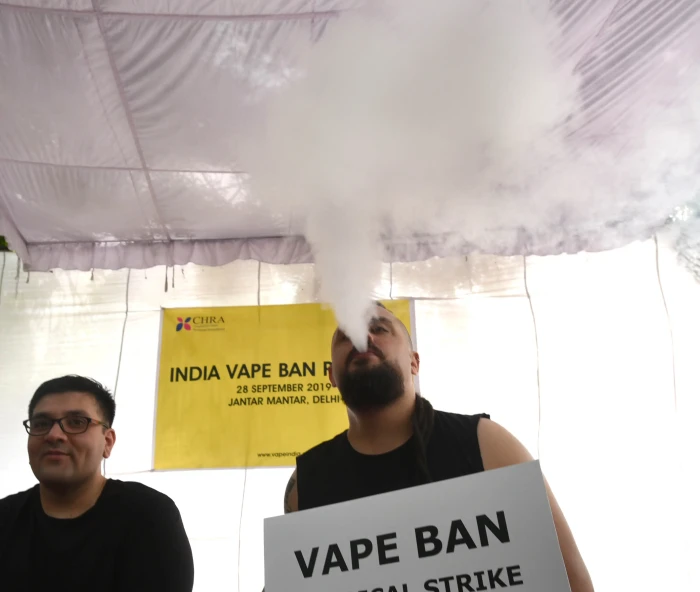 Teen vaping with flavored e-cigarettes, highlighting youth vaping surge and regulations