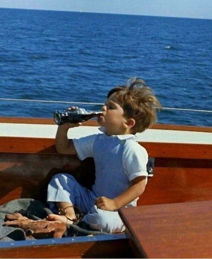 "John F. Kennedy Jr. Drinking A Coca-Cola Aboard The Honey Fitz, Hyannis Port, MA. 1963"