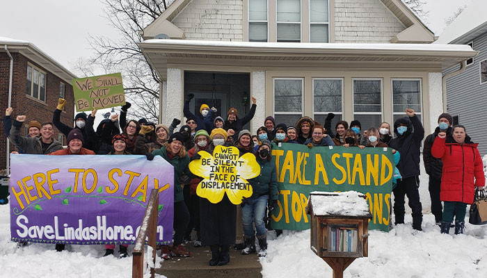 Her name's Linda Taylor, and she has been raising her five children in this little white house they call home near Powderhorn Park in Minneapolis for 18 years.