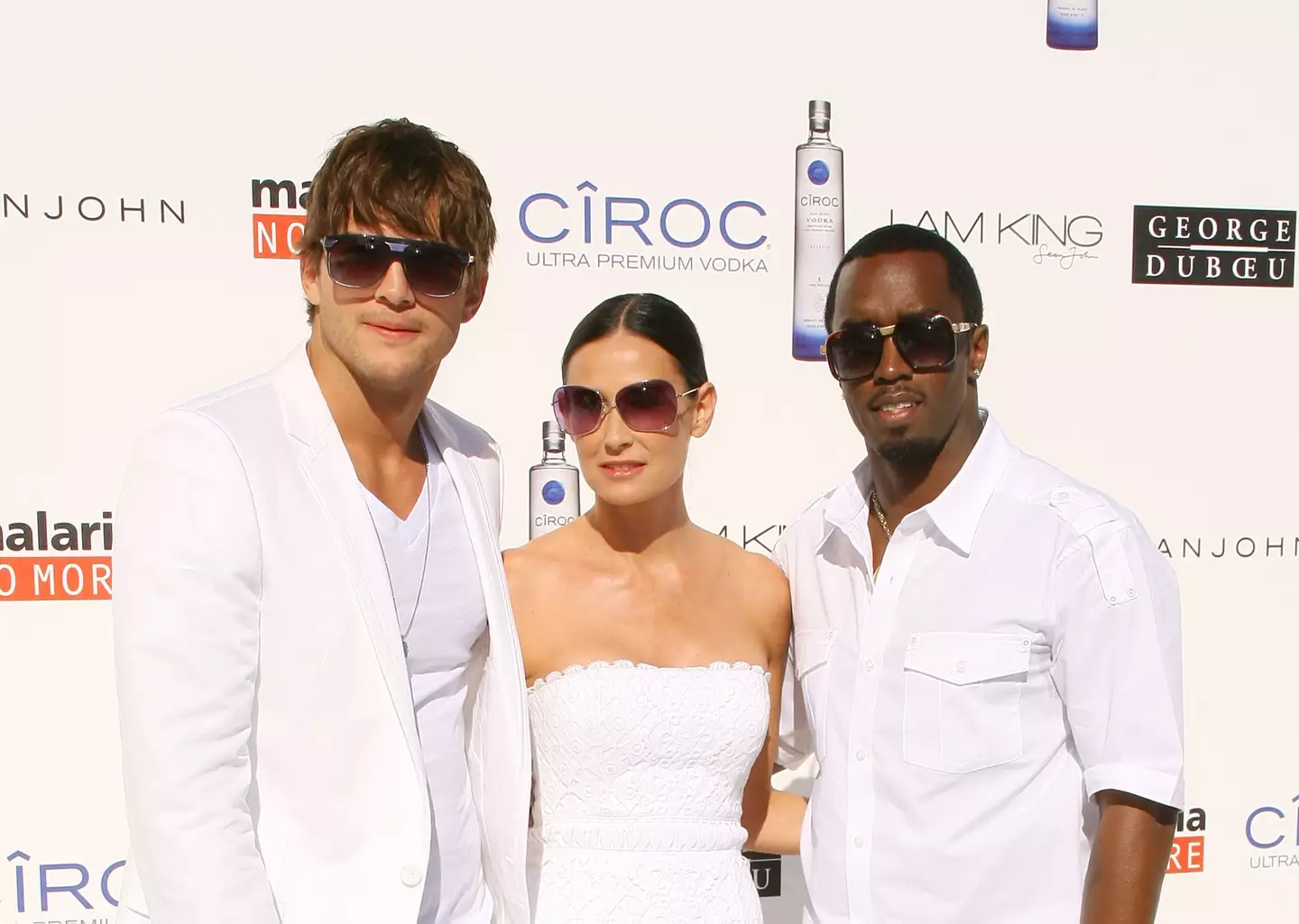 Ashton Kutcher, Demi Moore and P Diddy seen in 2009.