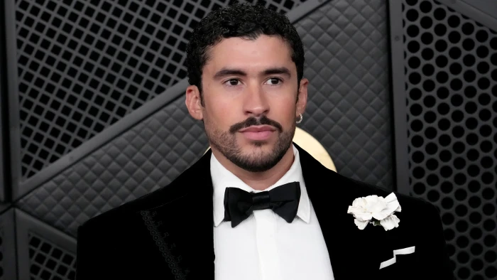 Bad Bunny and Edward Norton posing with director Jacobo Morales, Puerto Rico film collaboration