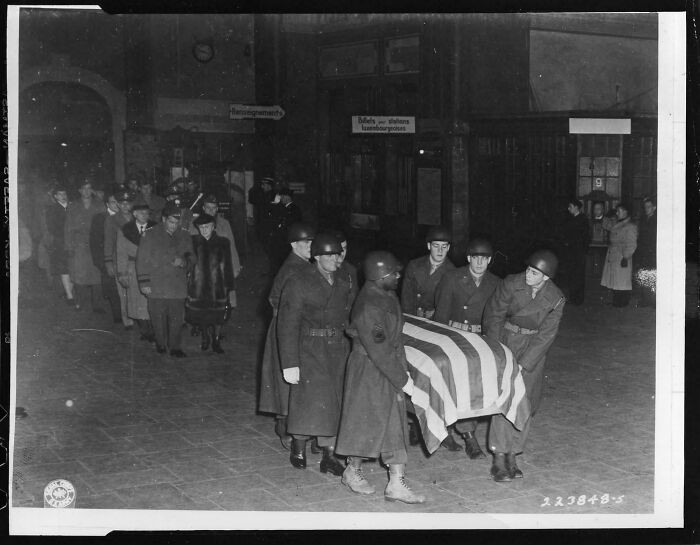 "Pallbearers Carry General George S. Patton, Jr.'s Casket Through the Station at Luxembourg City, Luxembourg, on Its Way to the Cemetery, 1945. Patton's Last Wish Was to Be Buried with His Men, Not at West Point as Was Originally Planned."