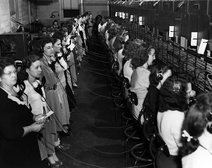 "Oak Bridge Telephone Operators Getting Ready For A Shift Change At The Switchboard"