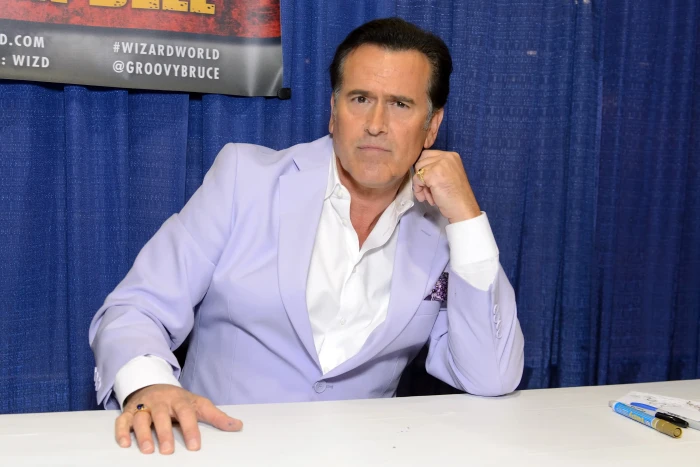 Bruce Campbell speaking publicly, acknowledging manageable cancer diagnosis and treatment journey.