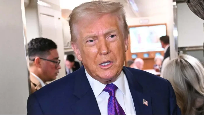 News anchor discussing Epstein document redactions, integrity of investigation process emphasized