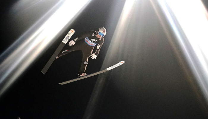 Ski jumping athletes in midair, debate over hyaluronic acid performance claims