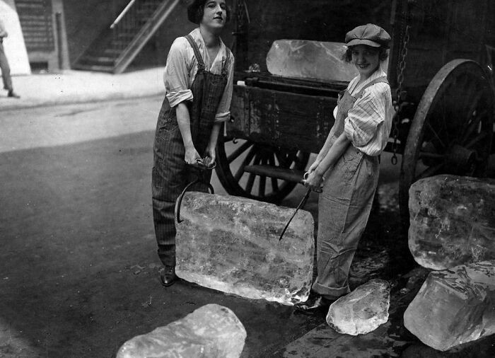 "Two Women Working As Ice Deliverers Carry A Large Block Of Ice. September 1918"