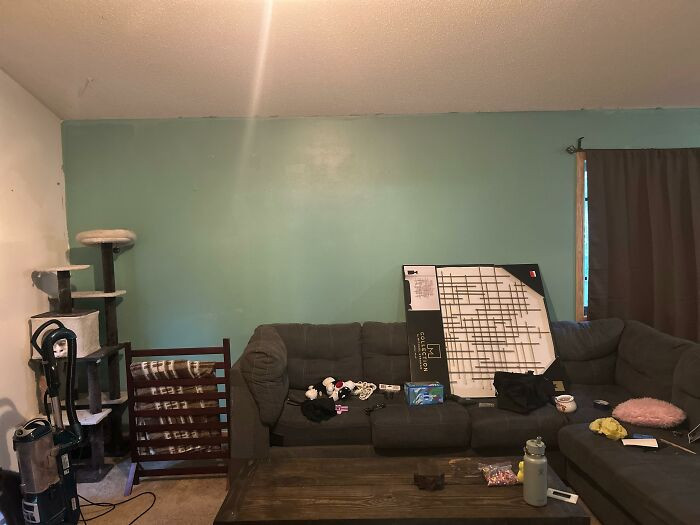 Room divider wall with cultural wall decor ideas, seeking feedback on styling.
