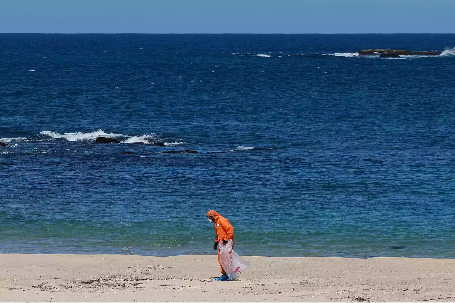 Cleanup efforts required significant manpower and specialized protective gear. Workers in hazmat suits faced the unpleasant task of collecting and removing the blobs, described as having a strong, foul odor.