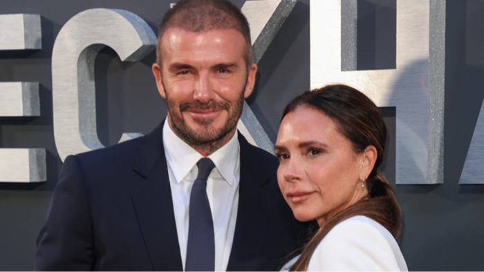 David Beckham posing at an event, refusing to comment on family remarks