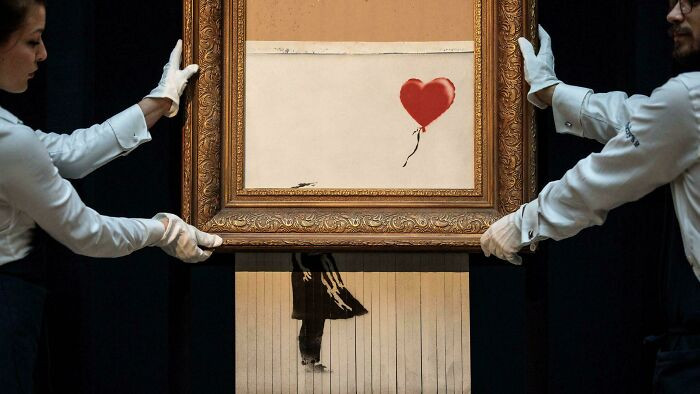 "Banksy hid a shredder inside his painting; it activated seconds after it sold for $1.4 million."