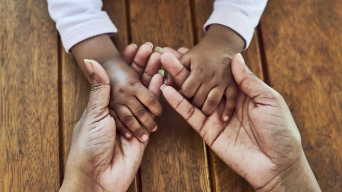 Parent walking through an Albanian street, highlighting safety, charm, and slow living
