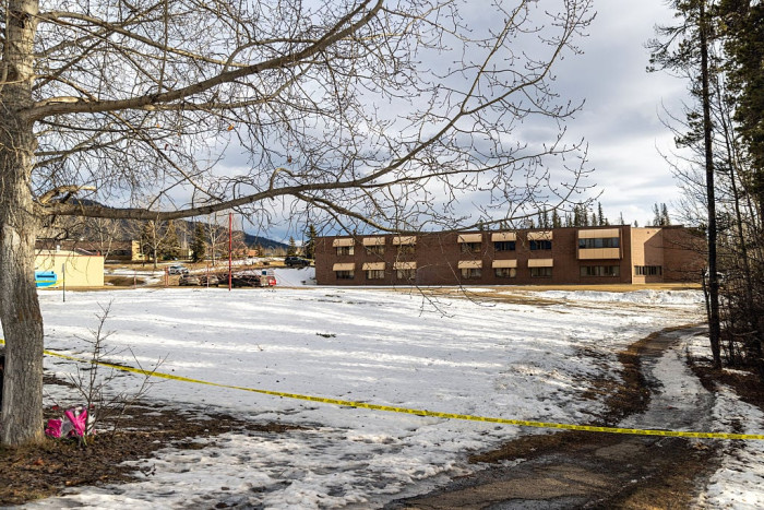 Police and emergency responders amid chaos in Tumbler Ridge following school shooting