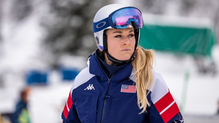 Airlift helicopter near the ski slope, emergency responders assisting injured Lindsay Vonn.