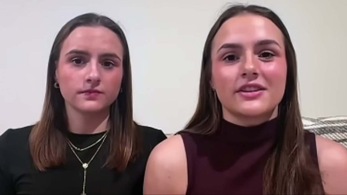 Young girl survivor recounts shark attack, with ocean backdrop and injuries
