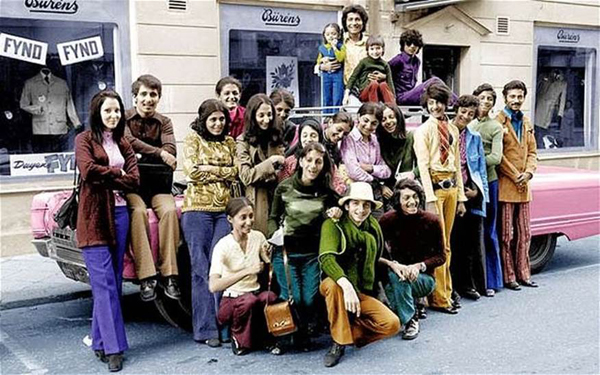 13. This image captures a young Osama Bin Laden with his family in Sweden during the 1970s. Bin Laden is positioned second from the right, distinguishable in a green shirt and blue pants.