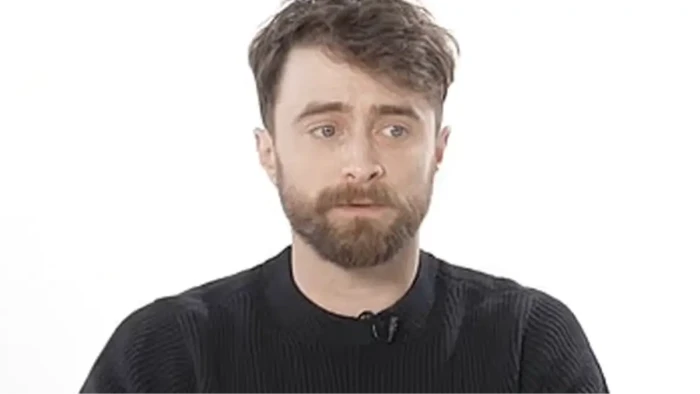 Daniel Radcliffe attends a promotional event, discussing pressure on young actors