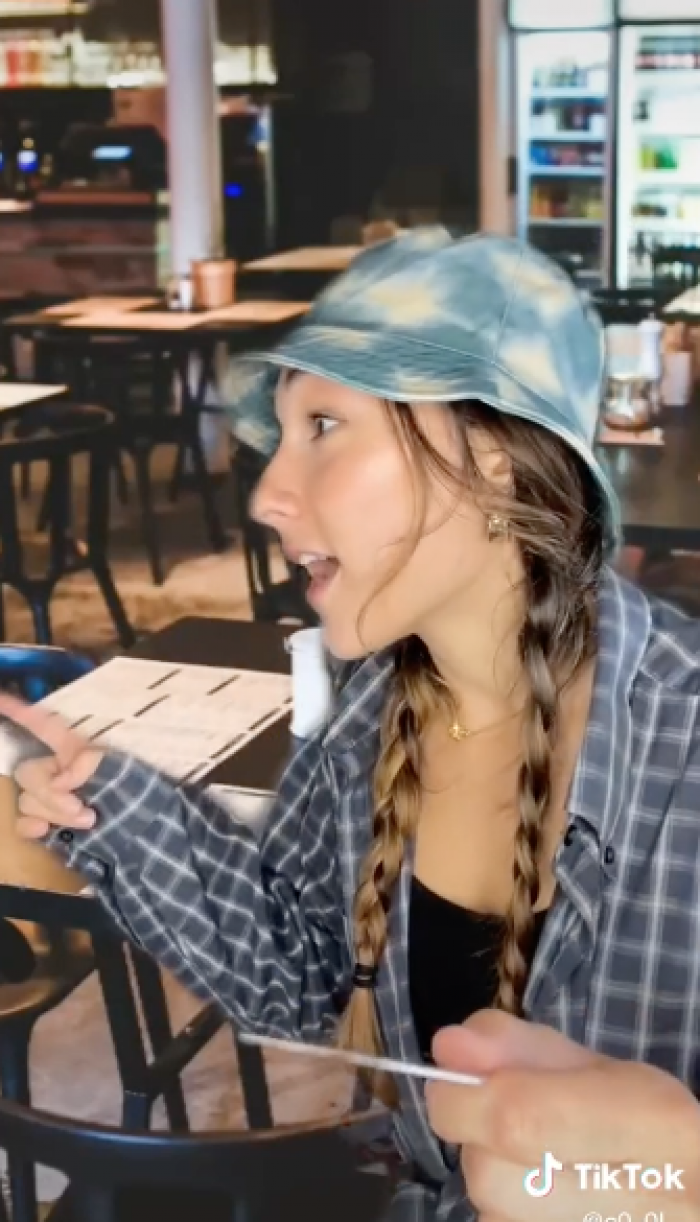 In the third video, Lizzy is with customers who won't stop arguing over who should pay the bill.