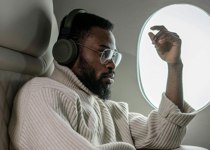 Noise-canceling headphones block out distractions, perfect for flights or any noisy place.