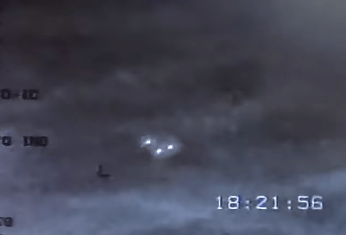 Military drone footage showing three orb UFOs flying in unison formation.