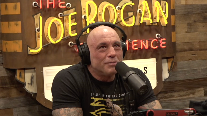 Joe Rogan gestures during a discussion about social media shaping political discourse