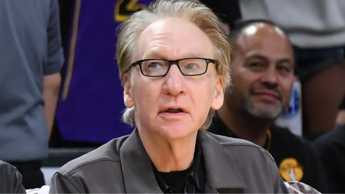 Bill Maher speaking on stage, referencing his message to Kid Rock