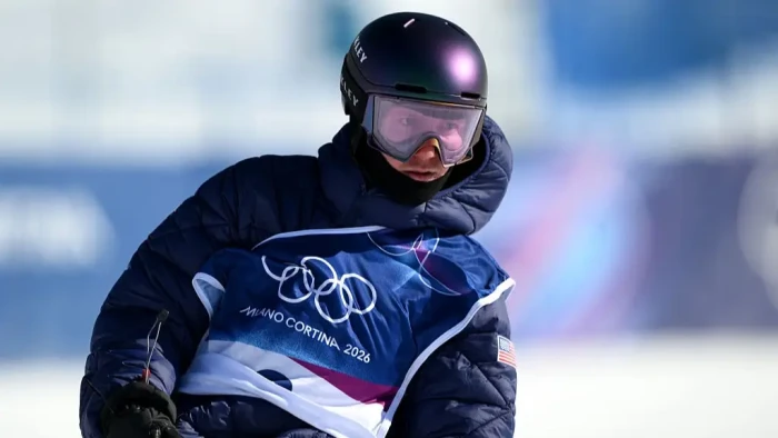 Young Team USA snowboarder celebrating gold victory, inspiring future Olympic snowboarders.