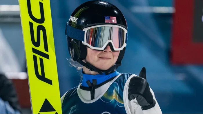 Ski jumper in Olympic competition on ski jump ramp after disqualification controversy