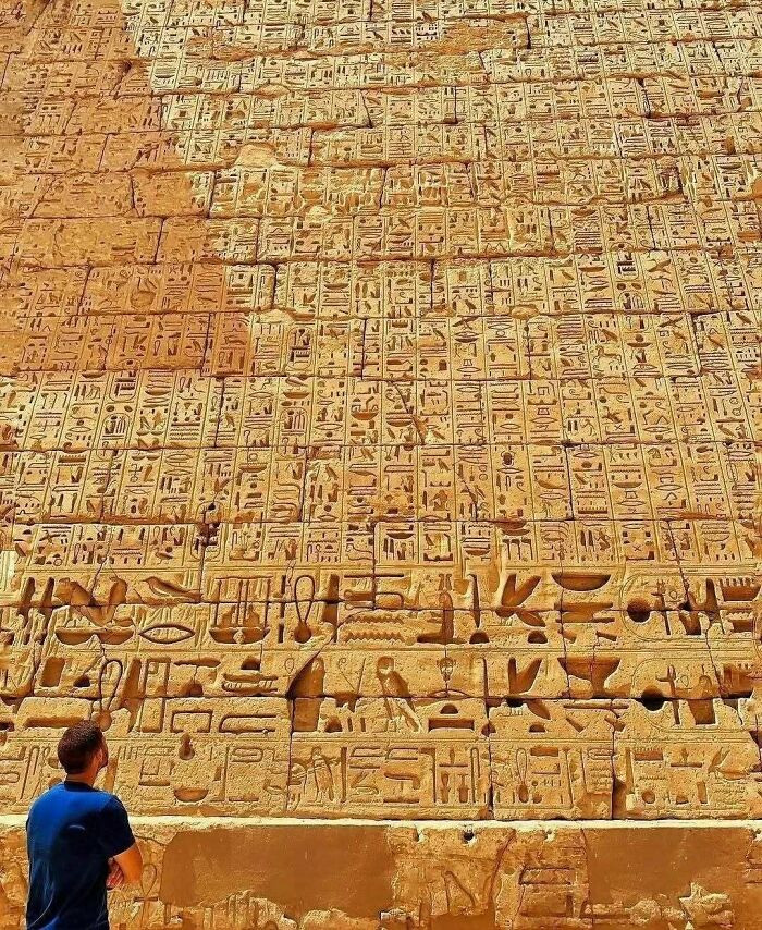 Wall inscriptions in hieroglyphics at the temple of Ramesses III (1186–1155 BC), Medinet Habu, West Bank of Luxor, Egypt.