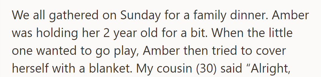At a family dinner, Amber held her two-year-old, then covered herself with a blanket when the child wanted to play.