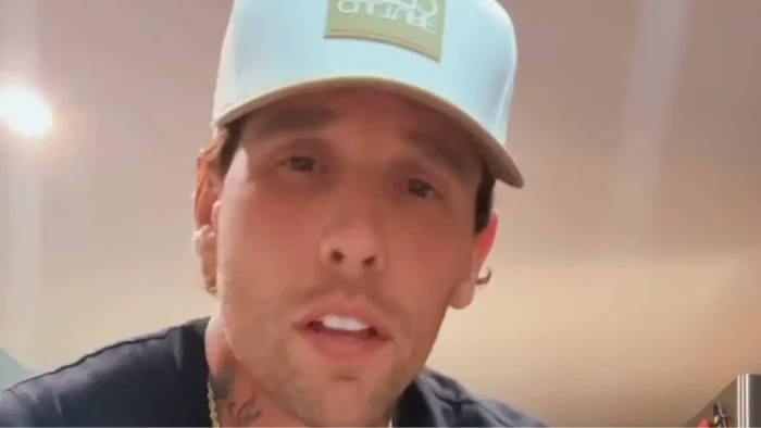 Corey Warren speaking on recognizing and supporting alcoholism, treatment access statistic shown