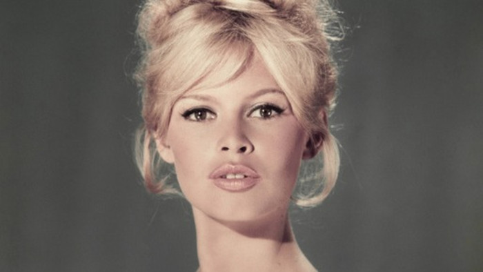 Brigitte Bardot speaking at an event, iconic French actress and singer
