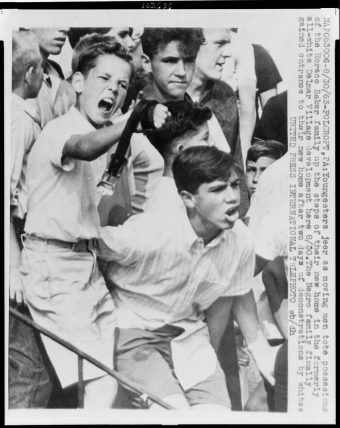 Teenagers protest the arrival of the Horace Baker family, the first Black family to move into the all-white Delmar Village in Folcroft, Pennsylvania, August 30, 1963.