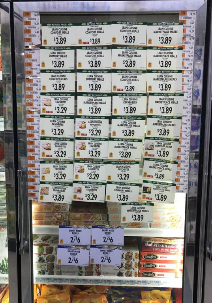 16. “The sale signs on this grocery store's freezer block your view of pretty much everything inside.”