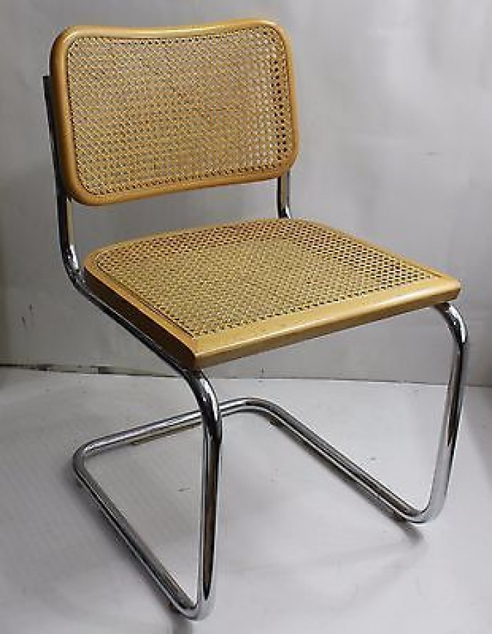 20. Chrome and Cane Wood Chairs