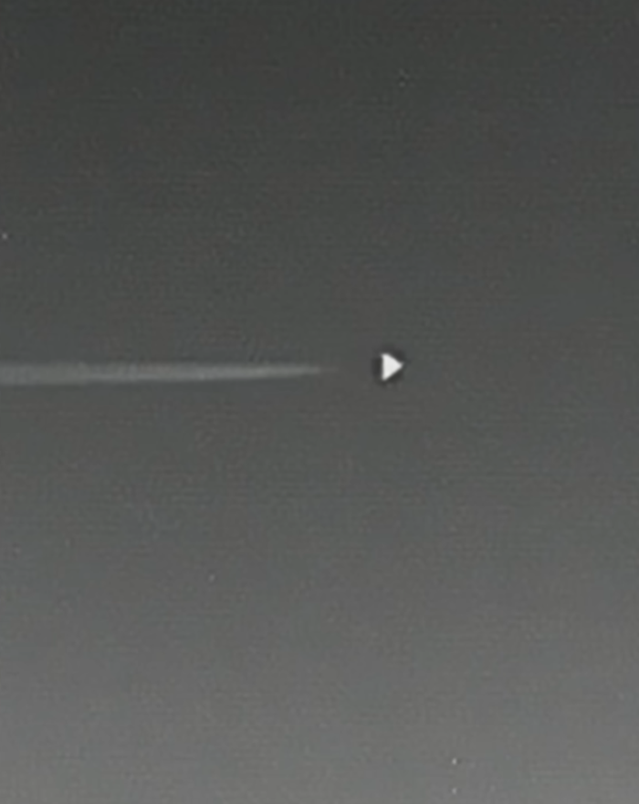 Unidentified dorito-shaped object hovering over Area 51 at night.