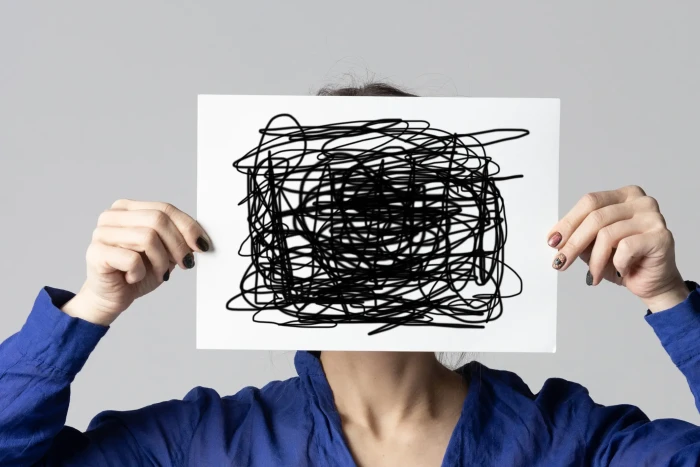 Person reading notes about seeking diagnosis for sociopathy and antisocial disorder
