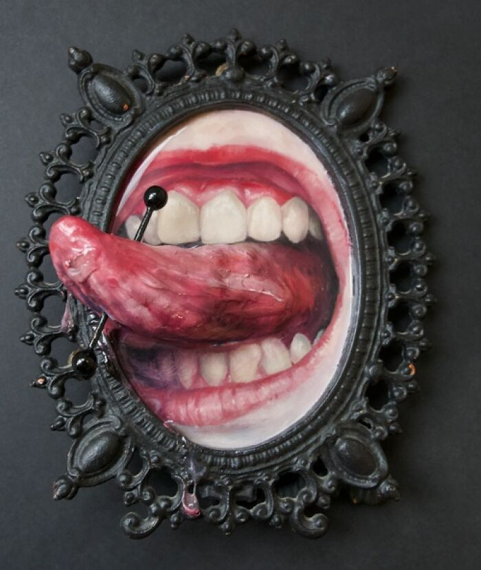 "Oil on panel, clay, modeling paste, found objects, and resin in vintage frame."
