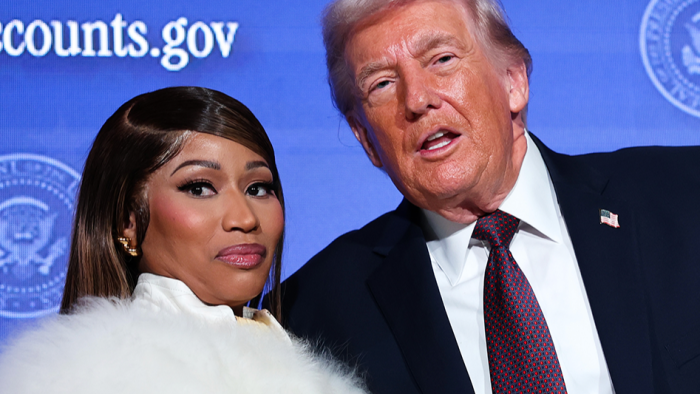 Nicki Minaj at event, referencing citizenship controversy and rumored Gold Card.