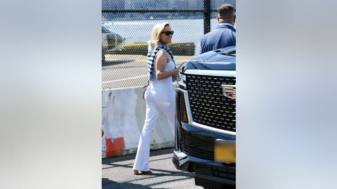 Reese arrives in style! Fresh off a helicopter ride with Oliver Haarmann and family